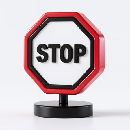 A red octagonal sign featuring the word STOP prominently on a white background stands on a black base against a plain white plain background.の素材