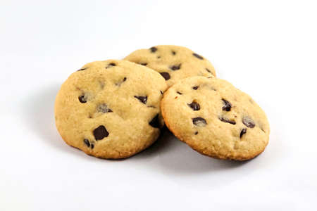 Pile of chocolate chip cookie in white isolated backgroundの写真素材