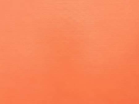 Orange painted wall. Abstract background for design with copy space for text or image.の素材
