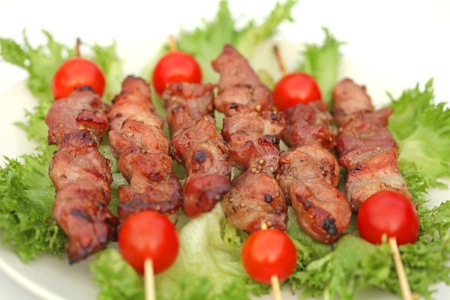 fried pieces of pork on a stickの写真素材