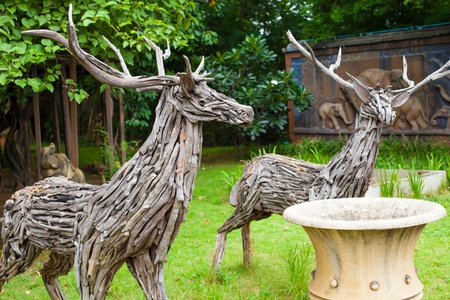 two deers made from pieces of woodの写真素材
