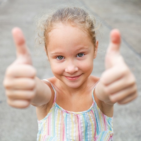 happy girl shows gesture coolの写真素材