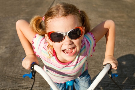 happy child on a bicycleの写真素材