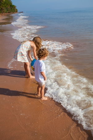 two kids playing on beach の写真素材