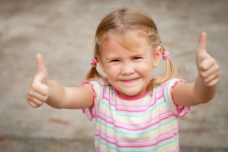 happy girl shows gesture coolの写真素材