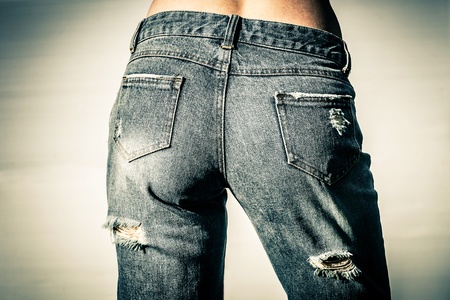 woman wearing denim shorts with holesの写真素材