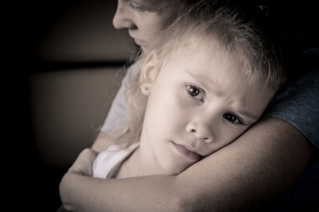 sad daughter hugging his mother