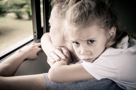 sad daughter hugging his motherの写真素材
