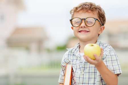 Portrait of Beautiful school boy looking very happy outdoors at the day time. Concept school theme.
