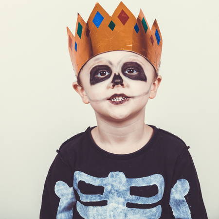 Little boy in costume skeletons.. Concept of death on Halloween party.の写真素材