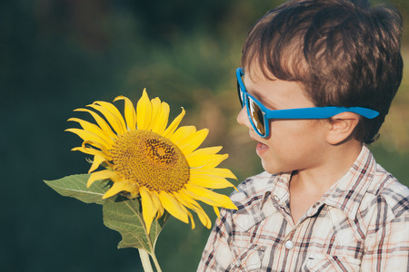 Portrait of one  beautiful  little boy. Kid having fun outdoors. Concept of happy summer day.の写真素材