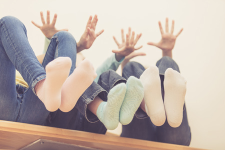 happy children which are sitting on the stairs in the house. The concept of a brother and sister...