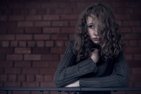 Portrait of a young sad girl. Concept of sarrow.の写真素材