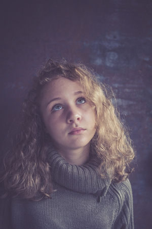 Portrait of a young sad girl. Concept of sarrow.の写真素材