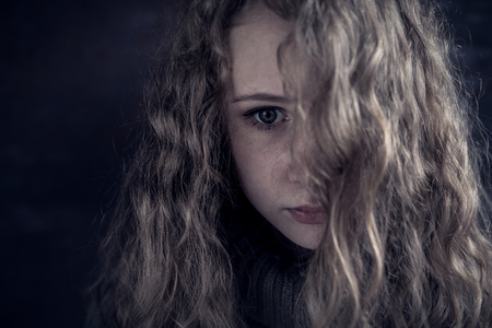Portrait of a young sad girl. Concept of sarrow.の写真素材