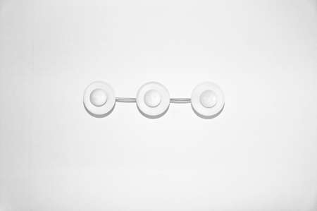Upper view on stylish modern beautiful white ceiling lamp indoor hanging round shape with three...