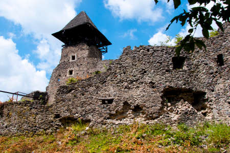 old ruined building from ancient stone of castle or palace with stony historical wall sunny day outdoor on blue sky backgroundの写真素材