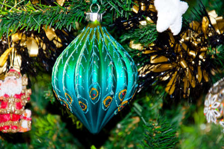 beautiful decorative xmas or new year ball color on green pine green christmas tree at holiday celebration decorationの写真素材
