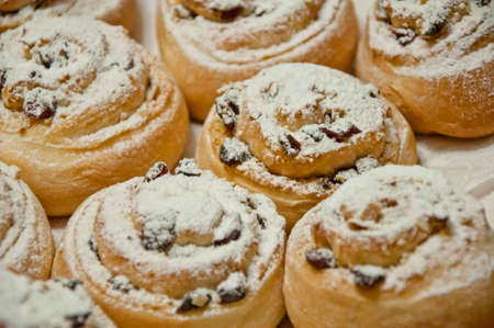 tasty christmas or xmas biscuits or cookies for new year with white glaze and icing on baked pastry decorated in winter as food backgroundの写真素材