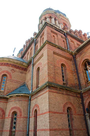 beautiful historical building of Chernivtsi national university religious seminary of red brick facade with blue sky sunny outdoor in Ukraineの写真素材