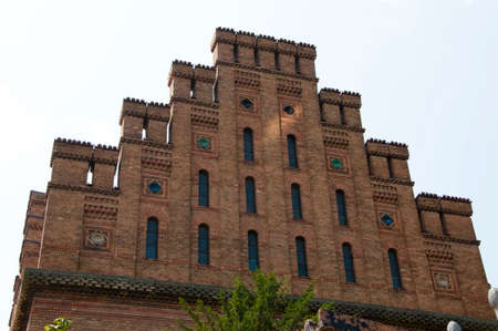 beautiful historical building of Chernivtsi national university religious seminary of red brick facade with blue sky sunny outdoor in Ukraineの写真素材