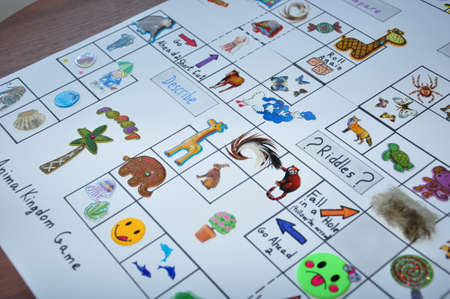 english lesson game on white paper with animal stickers and pictures for children education in school or kindergarten on tableの写真素材
