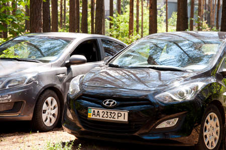 Kiev, Ukraine - June 16, 2017: Hyundai car black color and grey auto in forest outdoor