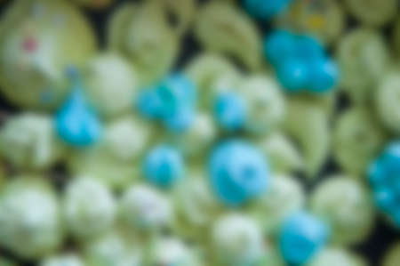 defocused background of green and blue meringue dessertの写真素材