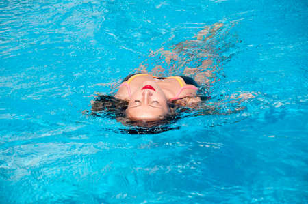 Summer vacation and travel to maldives. Sexy woman in swimming pool. Sexy girl with red lips and wet...