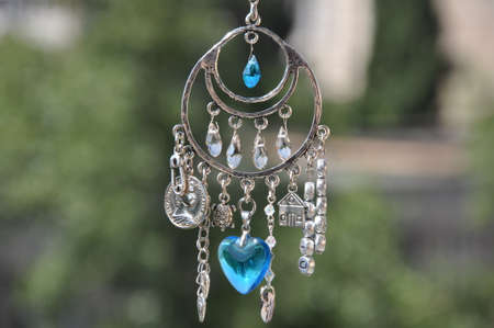 May luck be yours. Jewelry charm or talisman. Name amulet for good luck. Luck amulet hung out...