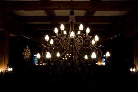 Lighting solution. Vintage antique chandelier. Electric lamp hanging from ceiling. Old ceiling lamp....