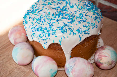 Spring holiday preparation. Marble shell. Painted eggs. Easter cake on table. Egg hunt. Traditional...