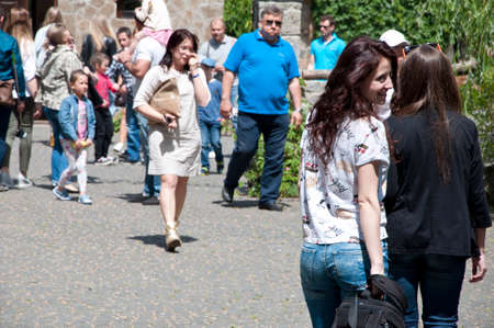 Radomyshl, Ukraine - June 06, 2017: crowded peopl. happy tourists walking in radomyshl park. travel...