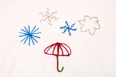 merry christmas. happy new year. xmas decoration. winter holiday party tinsel decor. festive background. umbrella and stars with snowflakes isolated on white.の写真素材