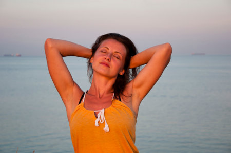 suntan woman portrait in summer fashion on sea background enjoy the sun.の写真素材
