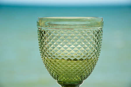 vintage wineglass with white wine. lemonade in goblet.の写真素材