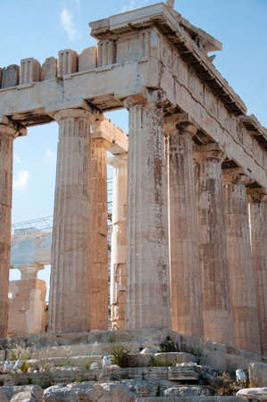 Ancient acropolis temple stone columns ruins on sky background.の写真素材