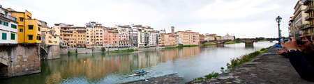 Florence skyline with Ponte Vecchio bridge over Arno river in Italy.のeditorial素材