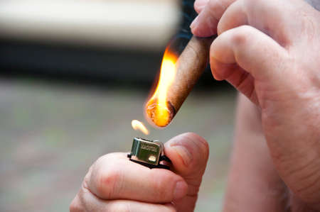 cuban cigar with ash. lighter with cuban cigar. smoking cuban cigar, weed.の写真素材