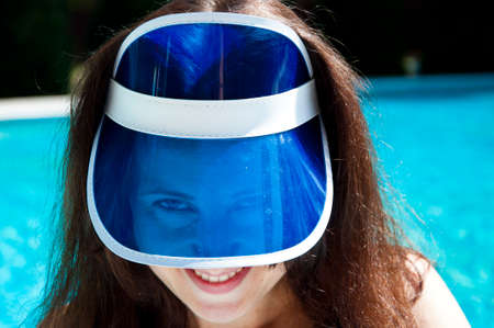 portrait of woman in retro visor hat. face of girl in visor cap. flirty girl in sun visor cap.の写真素材