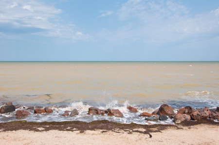Sea waves hitting rocky shore. Rippling sea or ocean water. Sea horizon sky background. Seascape.の写真素材
