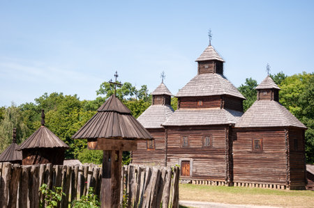 Old wooden church and churchyard folk architecture in ethnographic open-air museum in Pyrohiv, Ukraine.のeditorial素材