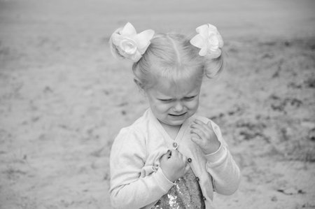 children's day. happy childhood. small child girl outdoor. little kid. preteen daughter has birthday. unhappy little girl.の写真素材