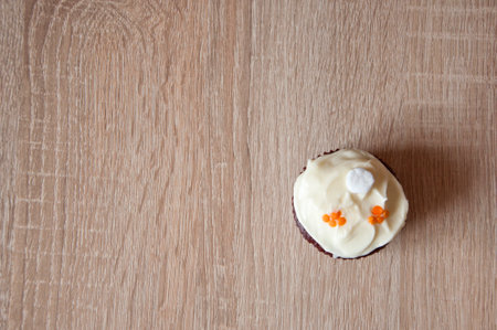frosting cupcake with cream. homemade cup cake with sprinkles. cupcake dessert. one yummy muffin. sweet food. delicious cupcake food. yummy and sweet dessert. confectionery. birthday cake. copyspace.の写真素材