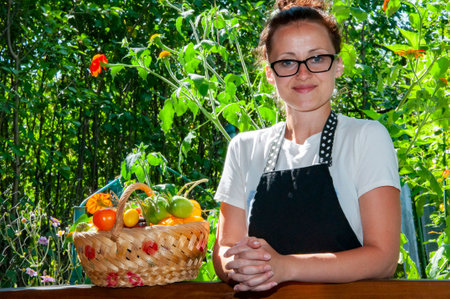 woman farmer with vegetable harvest. organic food and eco farming. greengrocer woman outdoor. harvester or gardener. summer harvesting. autumn vegetable harvest. agriculture crop. autumn harvest.の写真素材