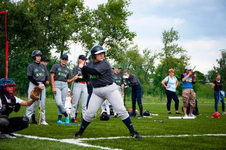 Kyiv, Ukraine - July 23, 2023: Baseball game with Ukrainian kid or child sport team. Pitcher...