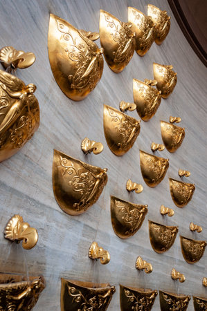 Fountain golden decoration of city architecture. Architecture of Kyiv. Architectural design. Fountain of desires. Golden fountain with gold bowl for water flow. Glamor architecture.の写真素材