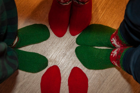 Xmas fun. Christmas family together. Happy family gathered at home on New Year. Winter holiday. Xmas and new year eve at home. Christmas knitted stocking. Family union at fireplace. Xmas present.の写真素材
