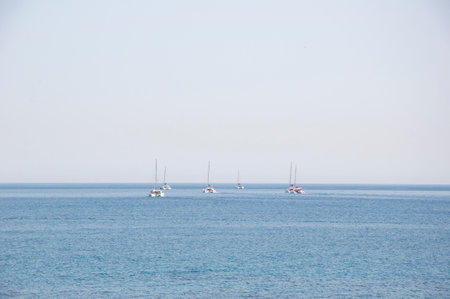 Catamaran sailing in sea. Luxury catamaran yacht aerial view. Summer vacation. Luxury travel lifestyle. Vacation on summer. Aerial catamaran at sea. Sea travel.の写真素材