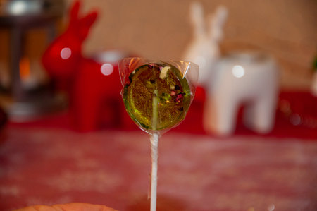 Organic homemade lollipop. Handmade yummy lollypop. Christmas candy. Lollipop for Christmas. Lollypop sugar candy stick. Caramel candy shop. Sweet tooth. Tooth fairy. Yummy lollipop. Sugary delight.の写真素材